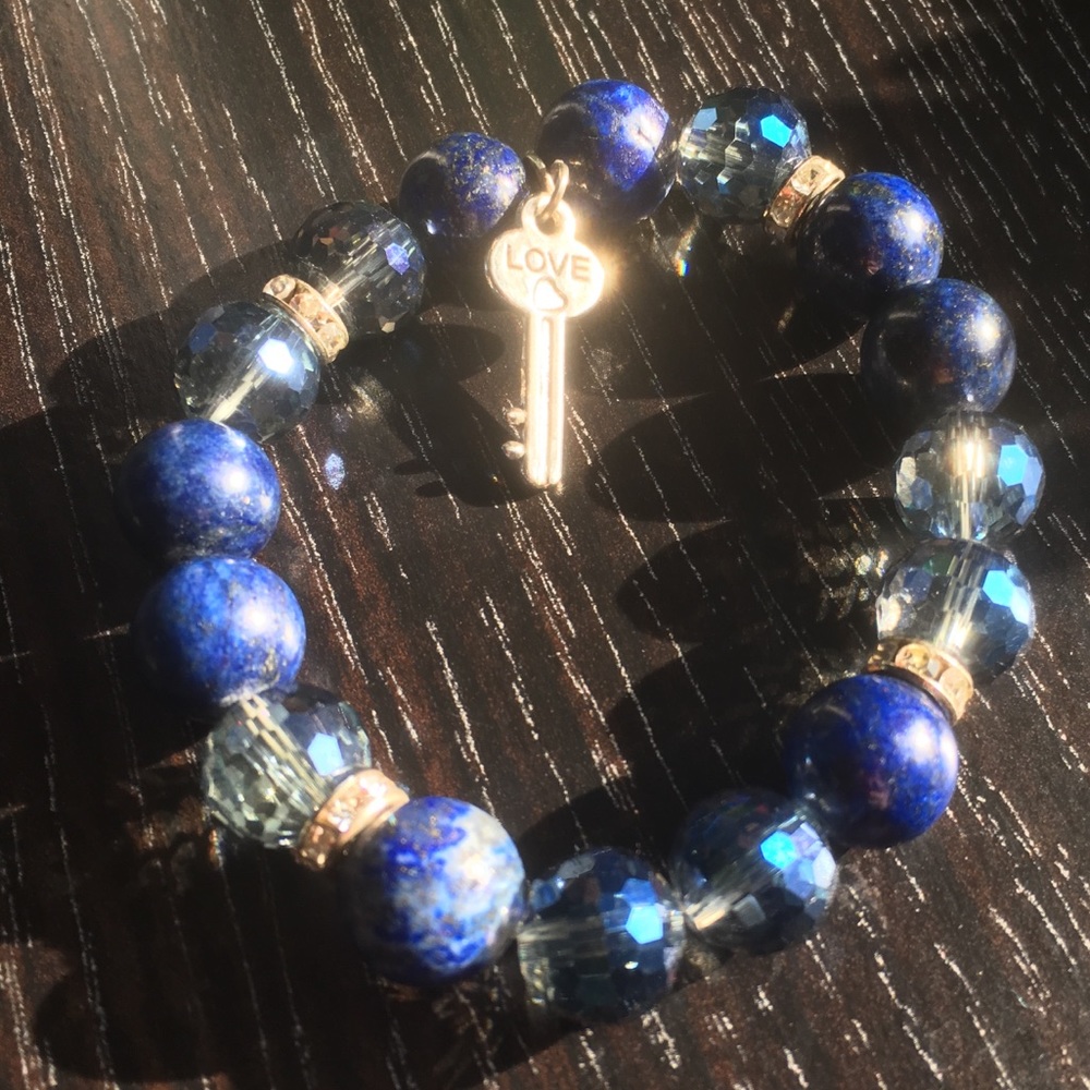 Blue glass bead bracelet with key charm